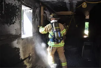 Firefighter in burned building