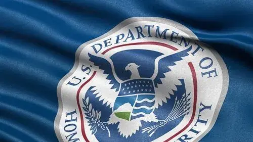 DHS logo on a blue flag