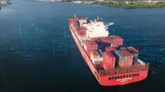 A cargo ship packed with boxes sailing 