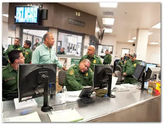 Slide 22: Secretary Jeh Johnson visiting with Customs and Border Protection officers at a CBP station