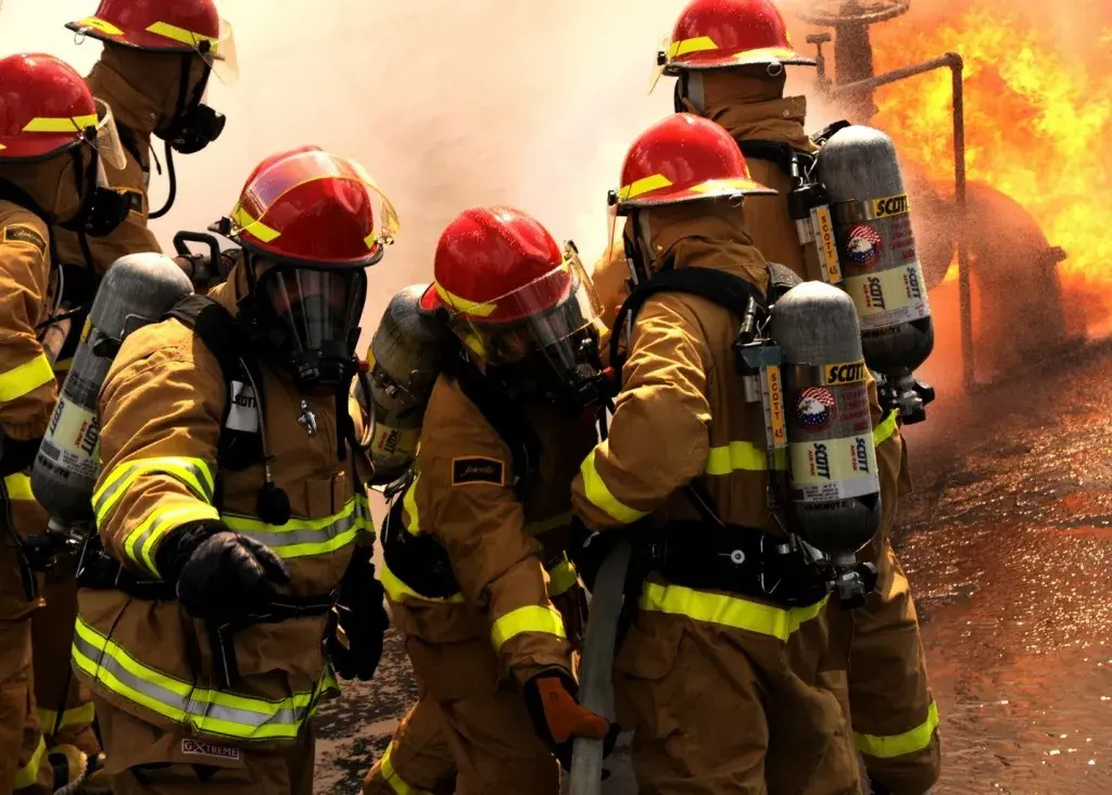 Six firefighters battling a blaze.