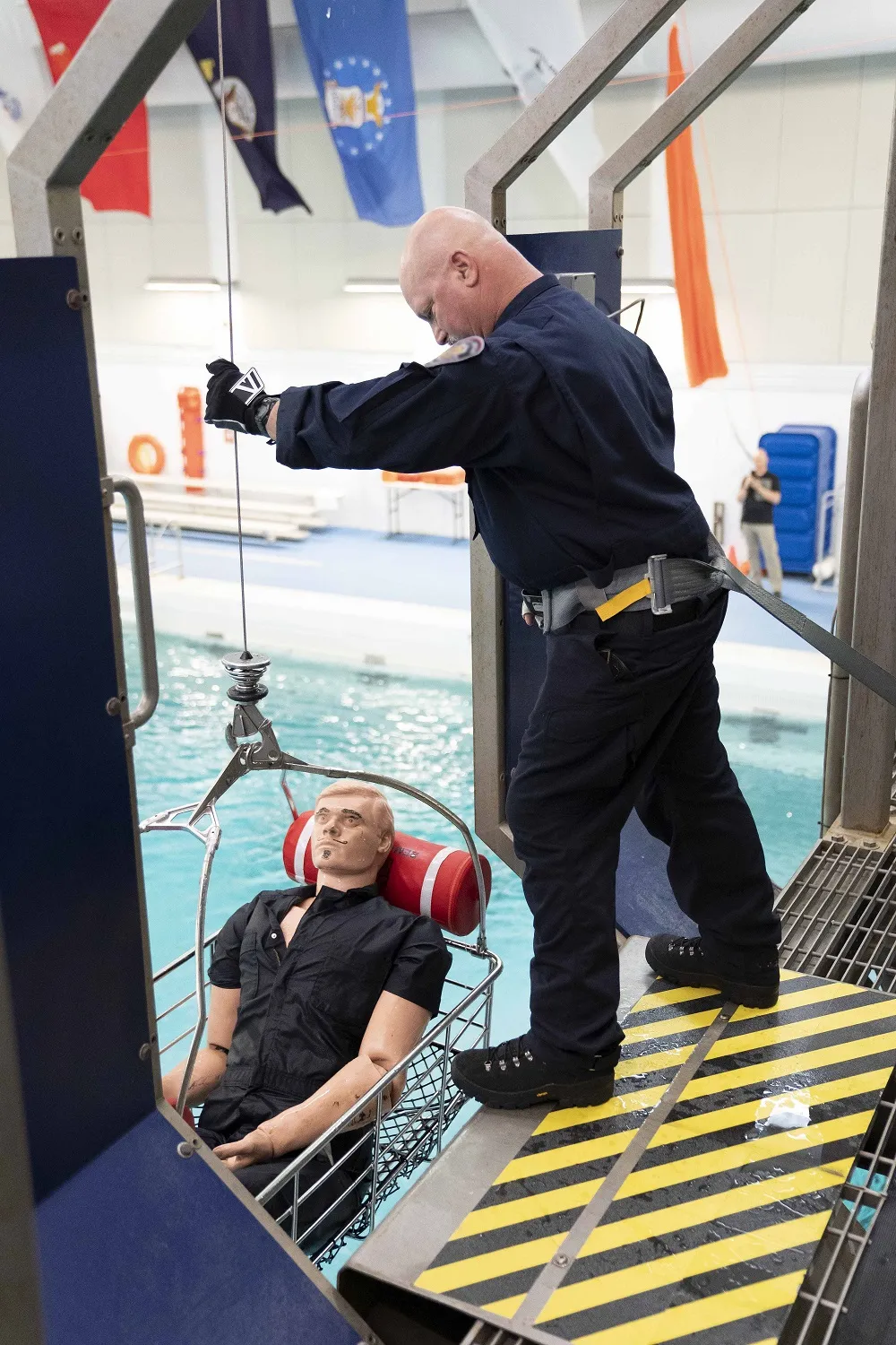 Evaluator participating in a rescue scenario at the operational field assessment at United States Coast Guard Aviation Technical Training Center in Elizabeth City, North Carolina.