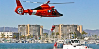 U.S. Coast Guard helicopter flying over city