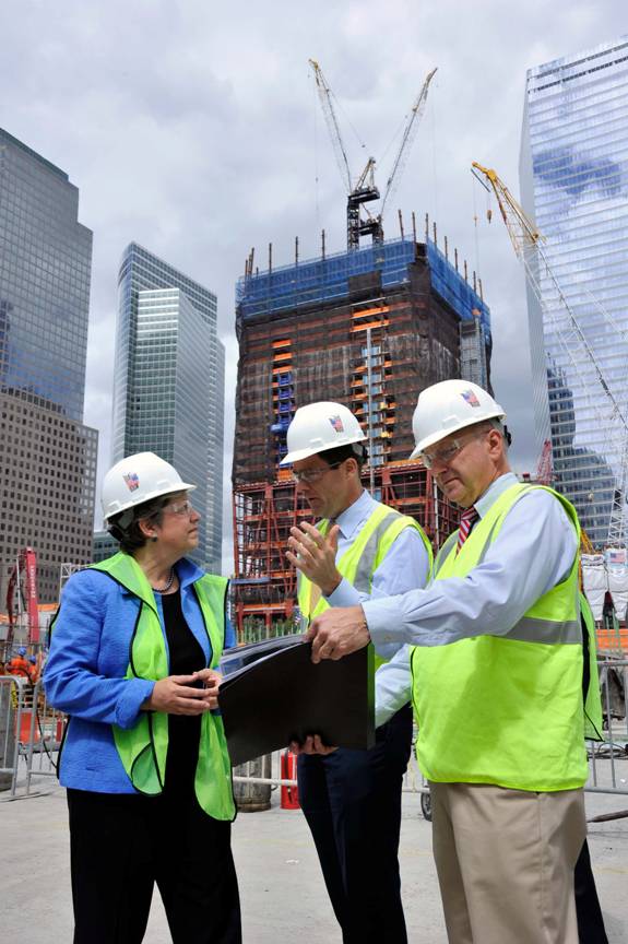 Secretary Napolitano stands in a construction site with Deputy Executive Director of The Port Authority of New York and New Jersey Bill Baroni and The Port Authority Director of World Trade Center Construction Steve Plate