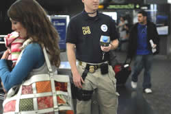 Officer conducting security at an airport.