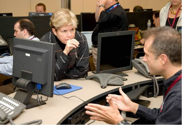 A Cyber Storm III exercise participant briefs Deputy Secretary Jane Holl Lute during the exercise kickoff at U.S. Secret Service headquarters in Washington, D.C.