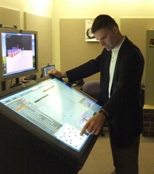  An instructor uses a prototype touch kiosk to move and align 3D modeled assets with the Site Security Planning Tool. Photo credit: United States Secret Service.