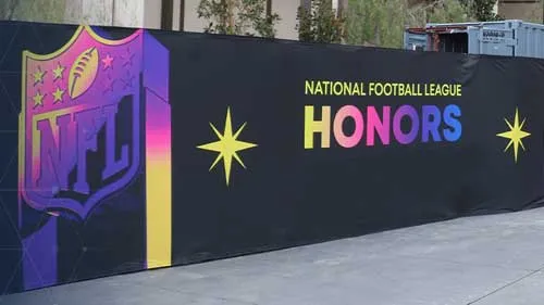 National Footbal League Honors printed on security barrier