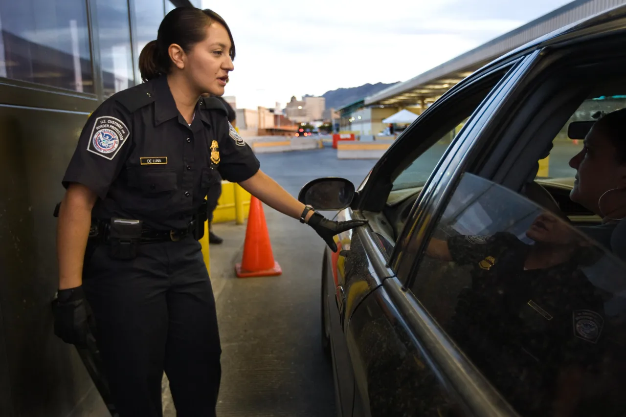 Image: U.S. Customs and Border Protection (CBP) Officer Talks to Car Driver at Border