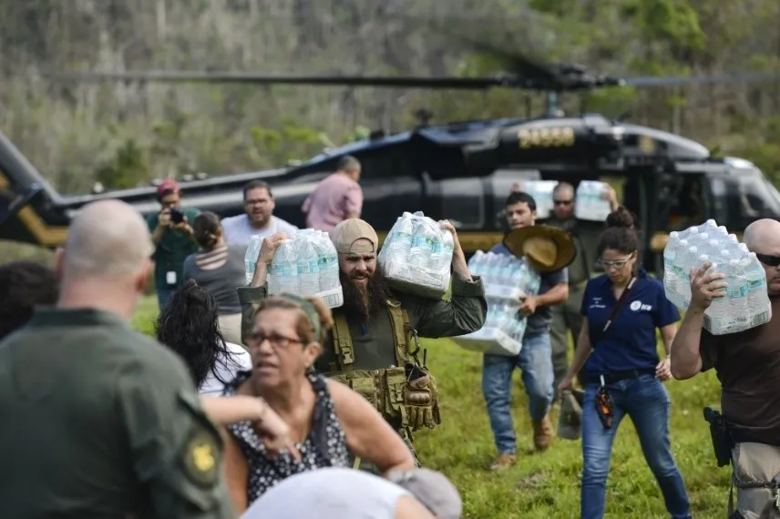 Image: U.S. Customs & Border Protection & FEMA personnel deliver food and water