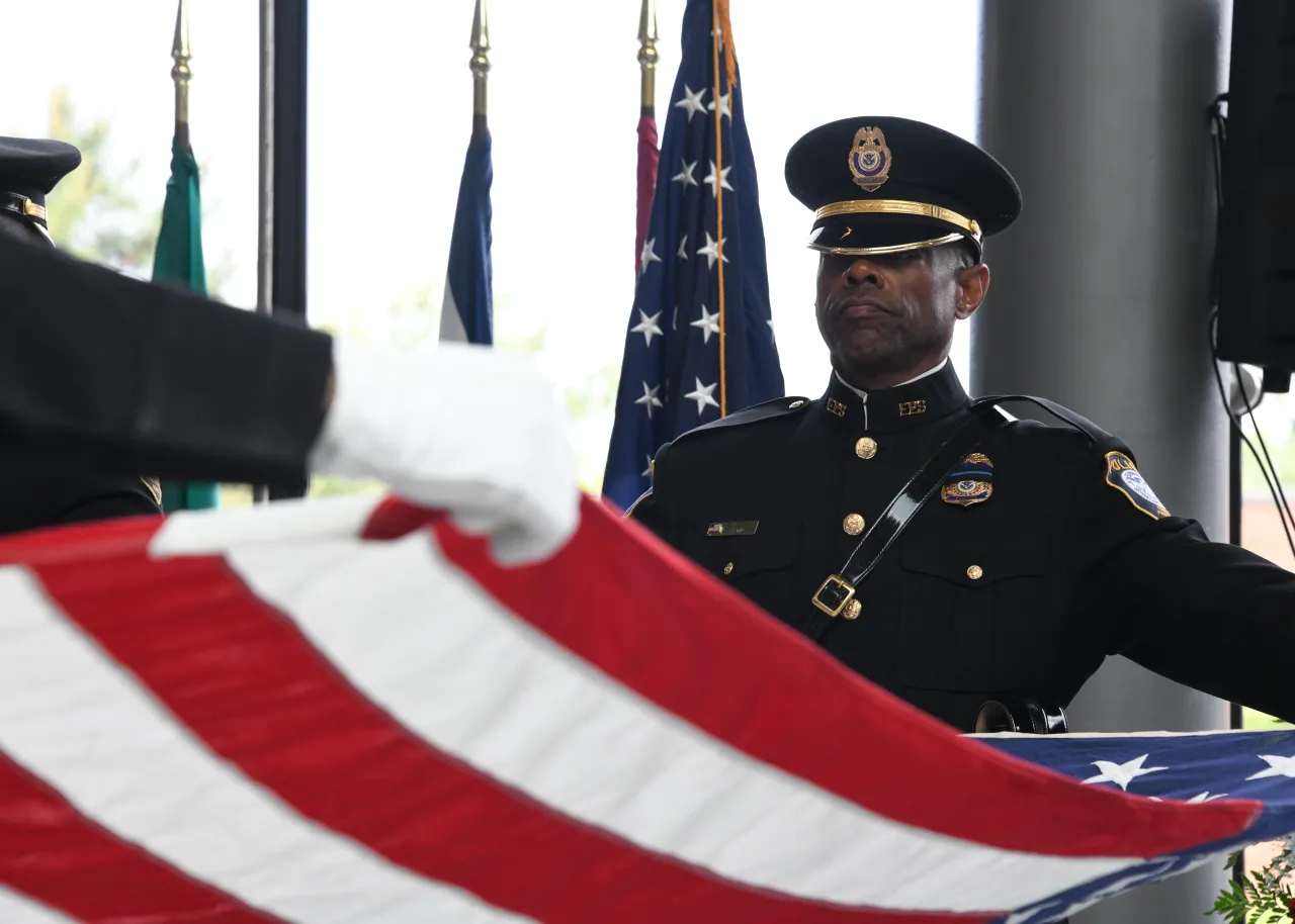 Image: Federal Protection Service (FPS) Officer Folds American Flag at Wreath Laying Ceremony