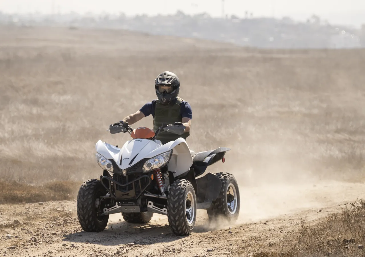 Image: U.S. Customs and Border Protection (CBP) Agent Driving an All-Terrain Vehicle (ATV)