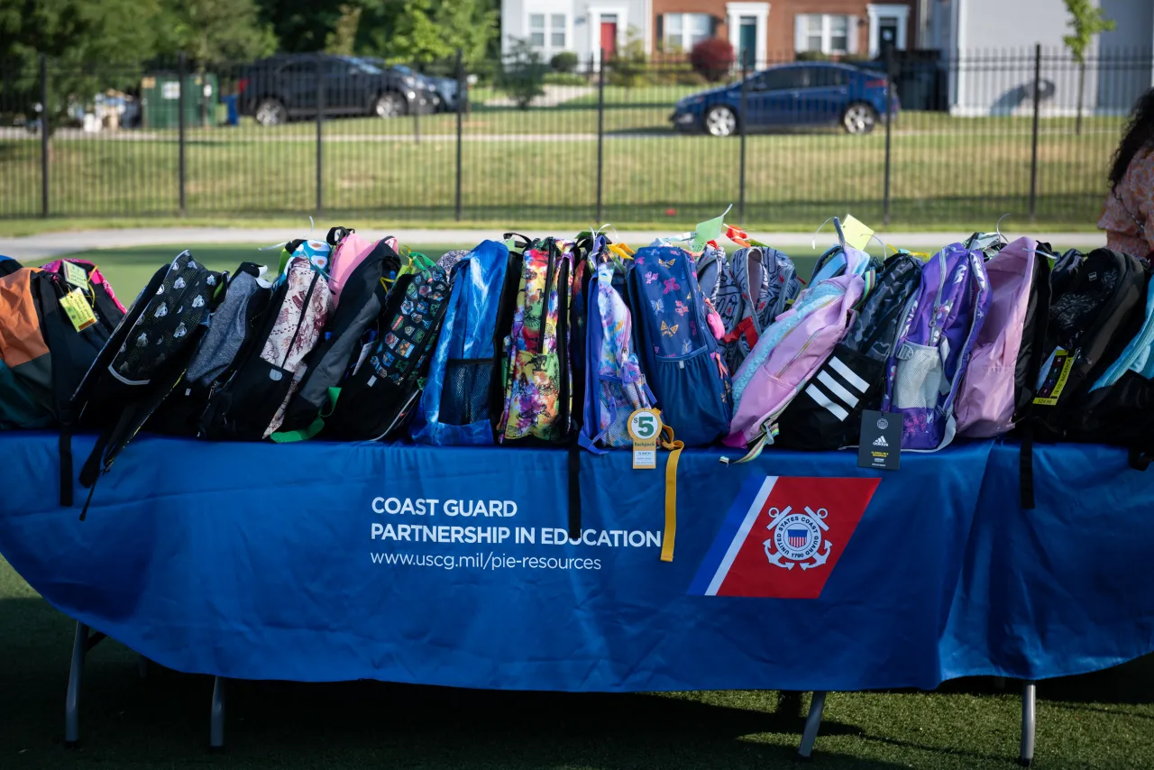 Image: Coast Guard Members Distribute Backpacks at Turner Elementary School (002)