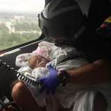 Image: Coast Guard aircrew assists infant during the aftermath of Hurricane Harvey