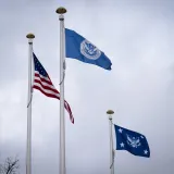 Image: American and DHS Flags Blow in the Wind