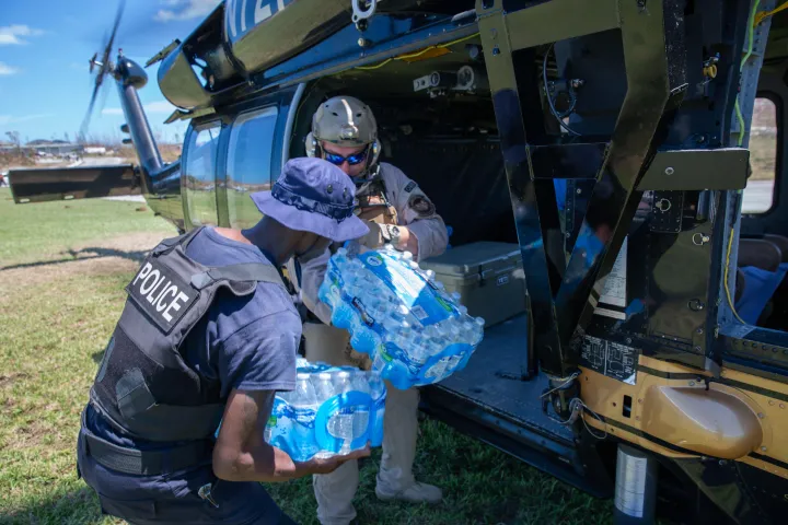 Image: U.S. Customs and Border Protection (CBP) Air and Marine Operations Agents Unload Water