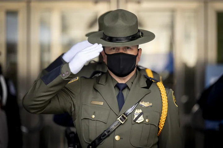Image: Customs and Border Patrol Agent Salutes