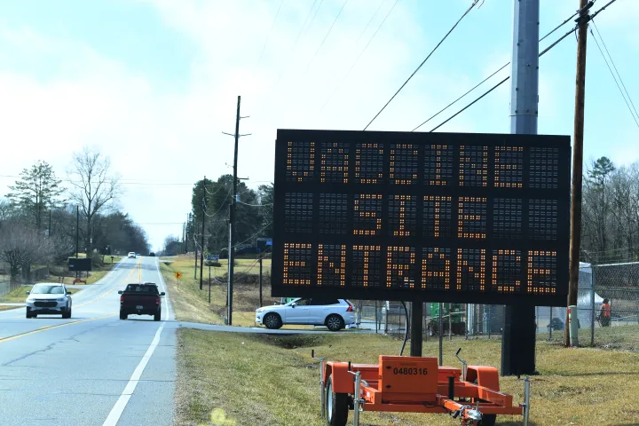 Image: Electric Road Sign Reads "Vaccine Site Entrance" In Georgia