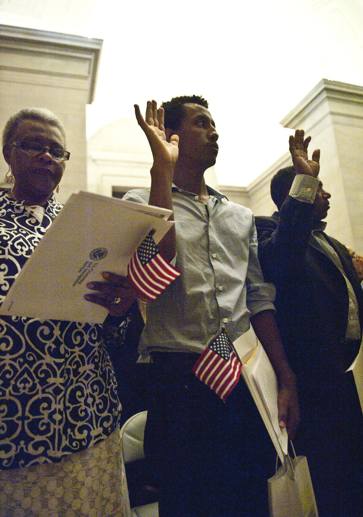 Citizens being sworn in at a naturalization ceremony