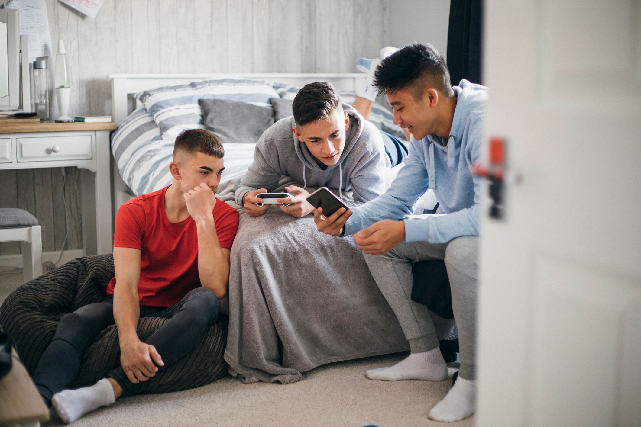 Teenagers looking at a message on a smartphone