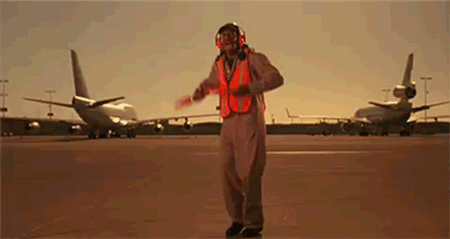 Animated image of a man dancing at an airport.  Courtesy of http://laughtilldeathh.tumblr.com
