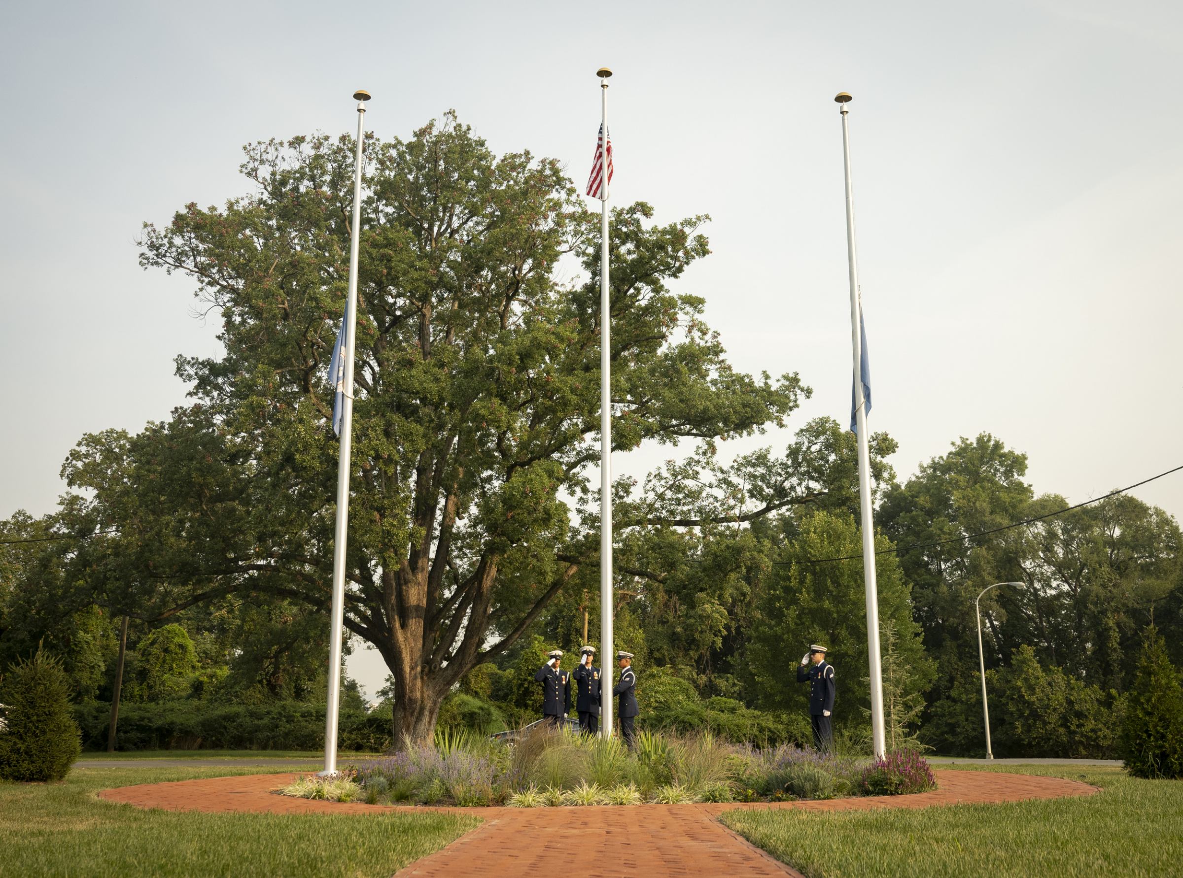 A flag is raised outside the Department of Homeland Security's Headquarters at St. Elizabeths. Official DHS Photo by Ben Applebaum.