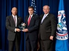 Special Agent Bronsteen receiving award from Secretary Johnson