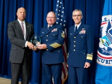Chief Petty Officer Meerscheidt receiving award from Secretary Johnson