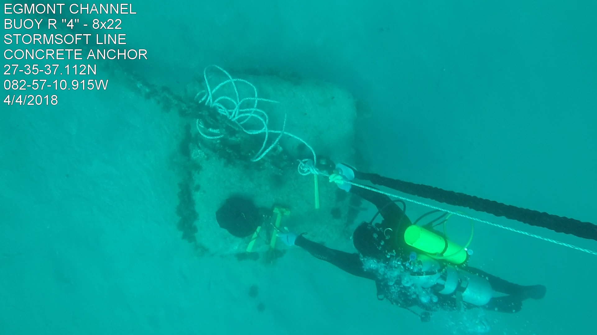A look from above, a diver attaches a StormSoft eco-mooring line to a concrete sinker. Underwater location: EGMONT CHannel; BUOY R "4" - 8x22; STORMSOFT LINE; CONCRETE ANCHOR; 27-35-37.112n; OB2-57-10.915W; 4/4/2018