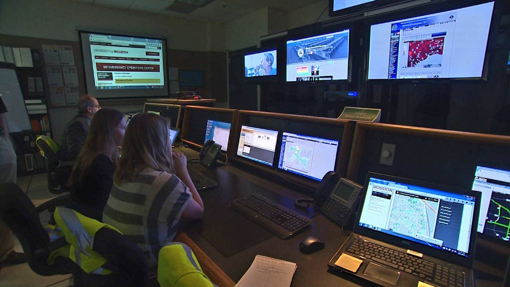 Group of public safety people viewing computer monitors