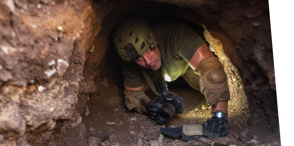 An agent going through an underground tunnel.