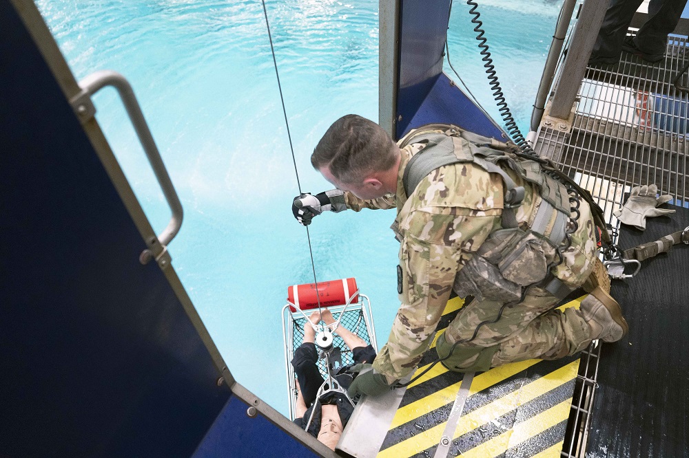 Evaluator participating in a rescue scenario at the operational field assessment at United States Coast Guard Aviation Technical Training Center in Elizabeth City, North Carolina.
