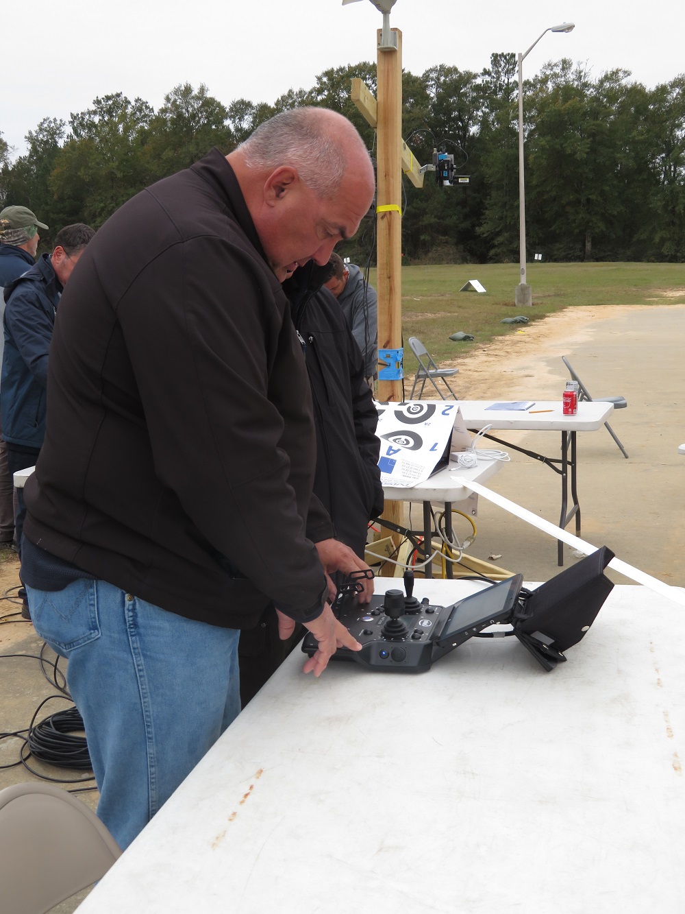 D.J. Smith from Virginia State Police operates the remote control of a Falcon 8+ drone by Intel. 