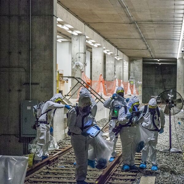 EPA teams collecting samples near entry of a mock subway system at Fort A.P. Hill military base in Virginia