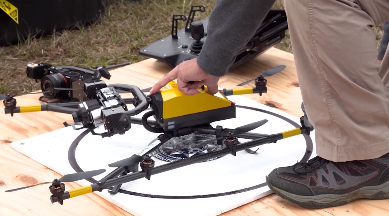 Drone is inspected by hand during First Responder Robotic Operations System Test