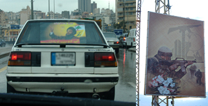 Sympathy for violent groups is evident in Lebanon: in these photos taken by Flanigan, Hassan Nasrallah, the head of Hezbollah, is displayed in a car, and a poster of a fighter hangs for all to see.