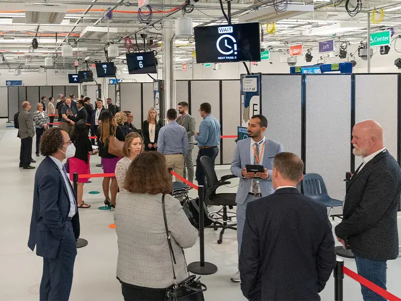 Participants in the 2022 Biometric Technology Rally line up in different cordoned-off sections to test facial recognition algorithms at the Maryland Test Facility.