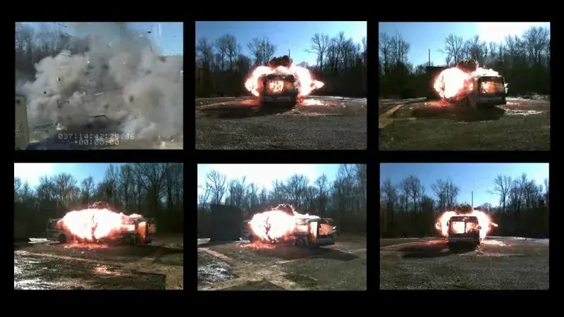 Capturing the testing of a bus blowing up. Includes 6 images of the bus burning.