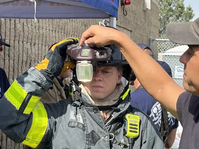 Firefighter familiarizes himself with the heads-up display of the C-THRU Navigator during an operational field assessment.