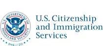 Horizontal USCIS wordmark/lockup in blue with "DHS at 20" below the DHS seal