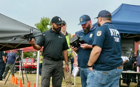 New York City first responders examine the drone and user interface of the Skydio X2 unmanned aircraft system (UAS). 