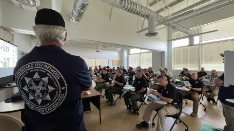 Drone pilots receiving classroom instruction.