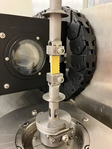 A 3-mm thick composite helmet shell (sample plaque) is tested using the torsion rectangular fixture on an ARES rheometer.