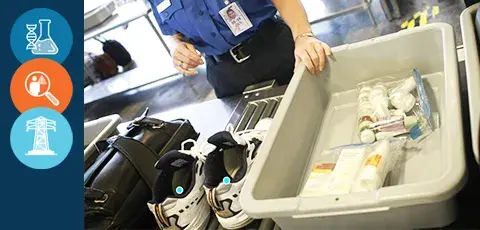 Several personal belongings at an airport security check point scanner counter.