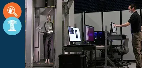A man working with the Millimeter Wave Scanning technology.
