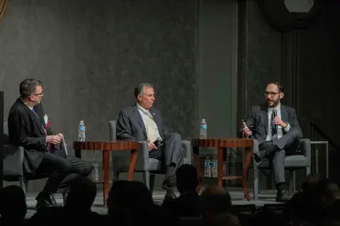 Moderator Dewey Murdick (left), of Georgetown University, listens on as Under Secretary Kusnezov and Eric Hysen discuss the DHS AI Taskforce.
