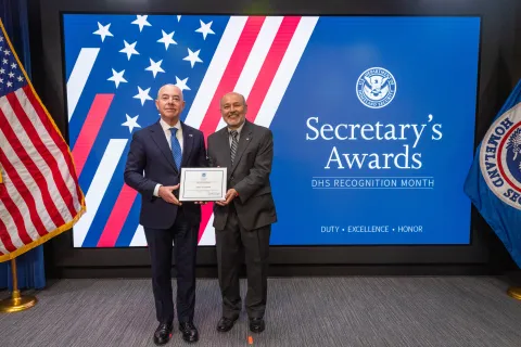 DHS Secretary Alejandro Mayorkas with Innovation Award recipient, Levent K. Ozdemir.