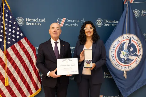 DHS Secretary Alejandro Mayorkas with Secretary's Gold Medal recipient, Noel L. Young.