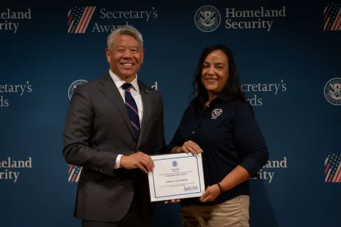 DHS Deputy Secretary John Tien with Team Excellence Award recipient, Chara A. Hutchinson.