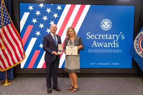 DHS Secretary Alejandro Mayorkas and Secretary's Gold Medal recipient Diane Sofastaii.